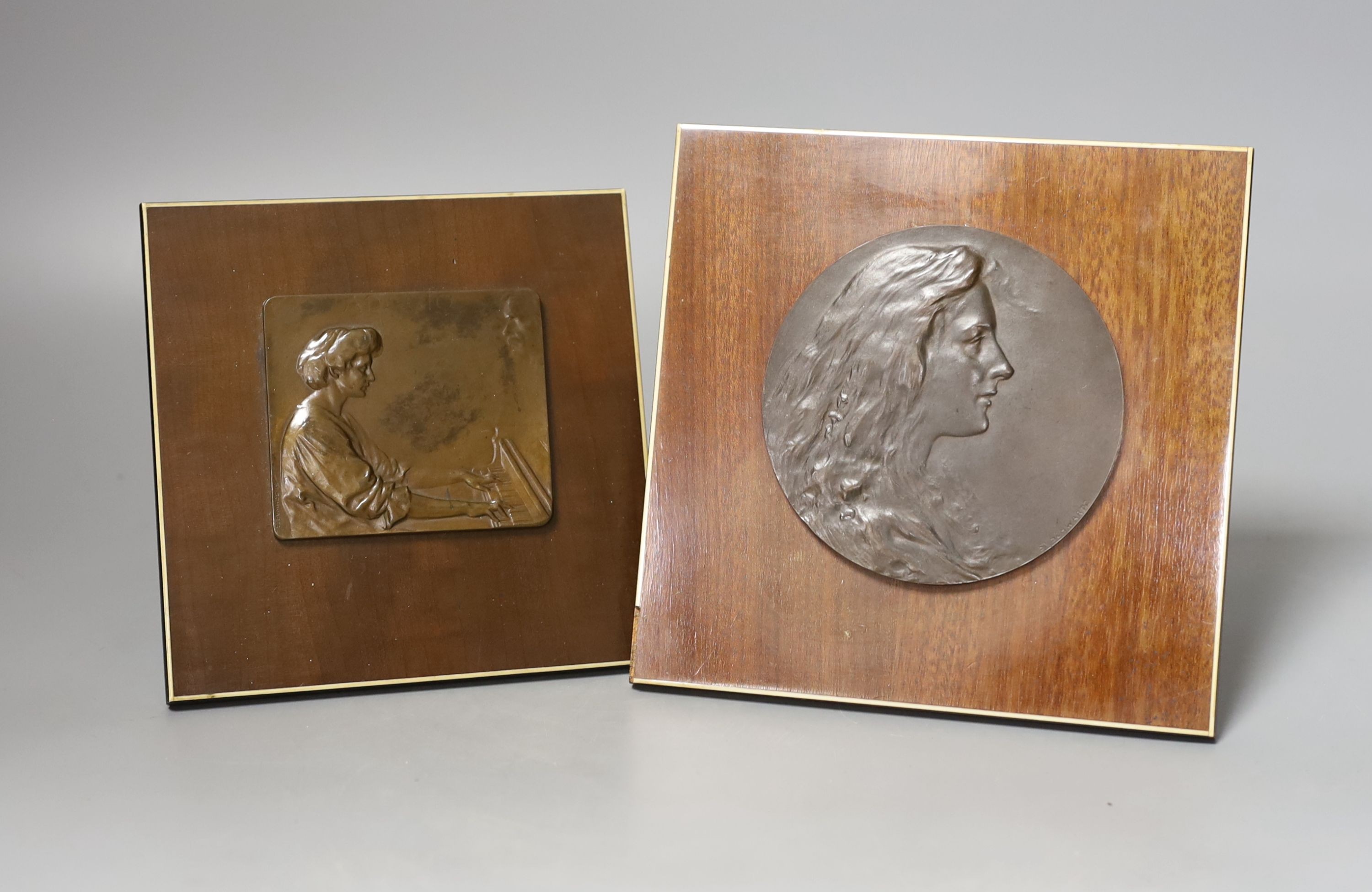 Two Stefan Schwartz bronze relief plaque, mounted on mahogany easels. Largest easel 16cm sq and an Art of Parqueter Mosaic Puzzle, Germany